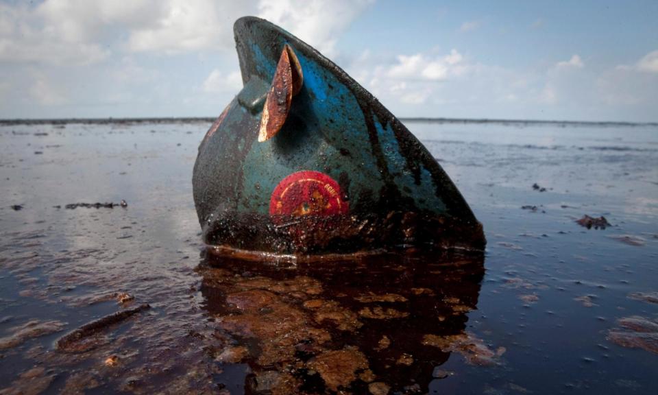 <span>A hard hat from an oil worker lies in oil from the Deepwater Horizon oil disaster on East Grand Terre Island, Louisiana June 8, 2010.</span><span>Photograph: Lee Celano/Reuters</span>