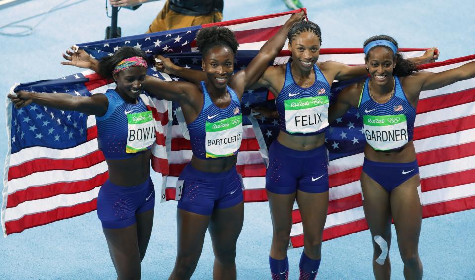 Tori Bowie, Tianna Bartoletta, Allyson Felix and English Gardner (USA) celebrate after winning the women's 4x100m relay final in the Rio 2016 Summer Olympic Games.