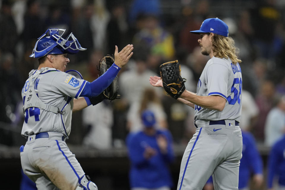 Kansas City Royals relief pitcher Scott Barlow celebrates with teammate catcher Freddy Fermin after the Royals defeated the San Diego Padres 5-4 in a baseball game Tuesday, May 16, 2023, in San Diego. (AP Photo/Gregory Bull)