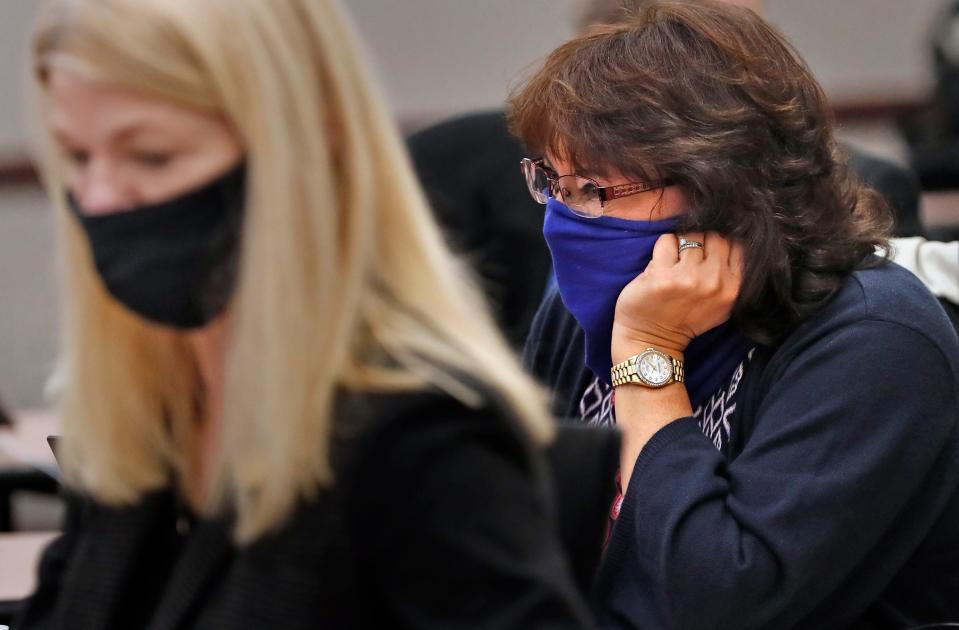 Rep. Peggy Mayfield, right, listens as the Indiana House meets, Thursday, Jan. 7, 2021, in its temporary chamber at the Government Center South in Indianapolis.