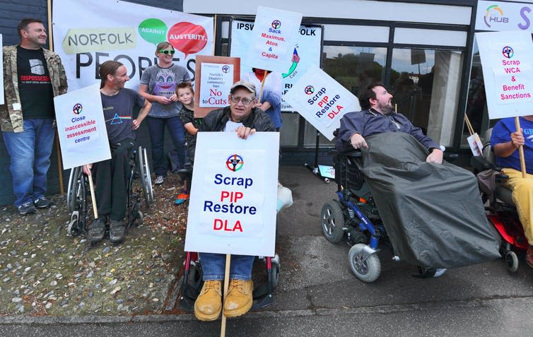 <span class="caption">A protest against personal independent payments in Norwich in 2016.</span> <span class="attribution"><a class="link " href="https://www.flickr.com/photos/rogerblackwell/28547605942/sizes/l" rel="nofollow noopener" target="_blank" data-ylk="slk:Roger Blackwell/flickr;elm:context_link;itc:0;sec:content-canvas">Roger Blackwell/flickr</a>, <a class="link " href="http://creativecommons.org/licenses/by/4.0/" rel="nofollow noopener" target="_blank" data-ylk="slk:CC BY;elm:context_link;itc:0;sec:content-canvas">CC BY</a></span>