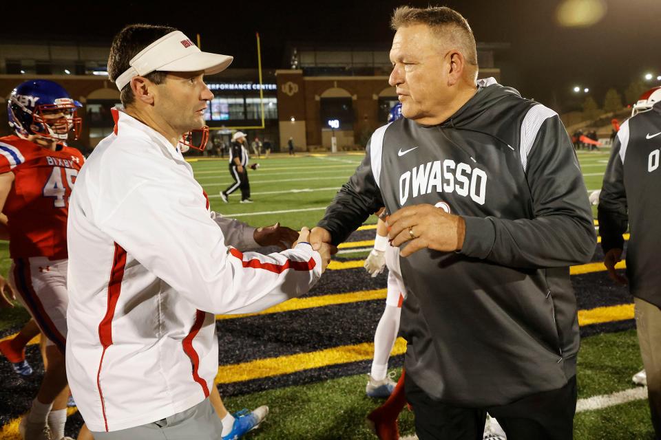 Bixby coach Loren Montgomery shakes hands with Owasso coach Bill Blankenship after their  6AI state championship football game at Chad Richison Stadium on the campus of the University of Central Oklahoma Friday, Dec. 2, 2022 in Edmond, Okla.