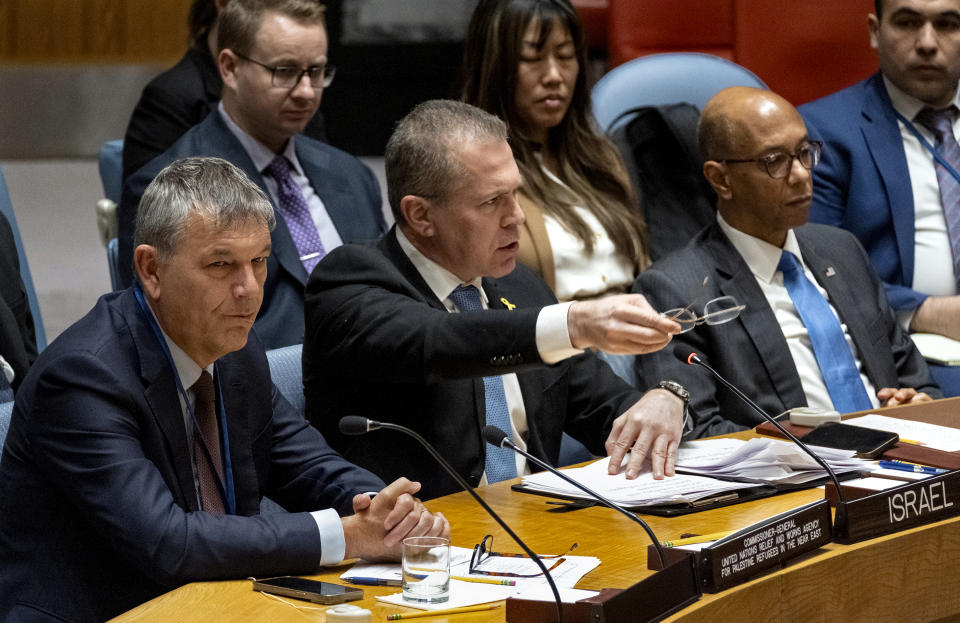 Israel's U.N. Ambassador Gilad Erdan, center, addresses members of the United Nations Security Council at U.N. Headquarters Wednesday, April 17, 2024. Commissioner-General of the U.N. Relief and Works Agency for Palestine Refugees, Philippe Lazzarini, left, and Robert A. Wood, United States Ambassador to the United Nations, right, look on.(AP Photo/Craig Ruttle)