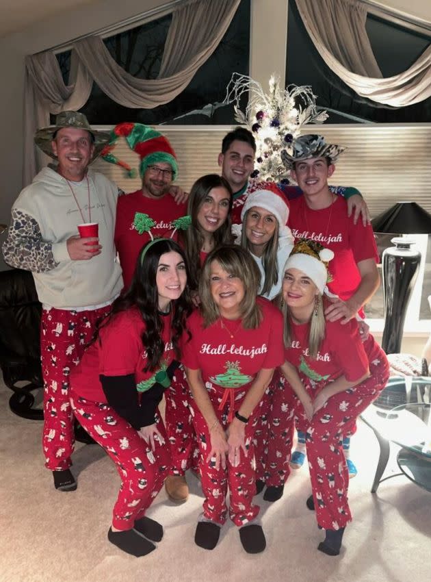 The author (bottom row, right), her mother (bottom row, middle) and brother (top row, second from left) celebrate the Hall-lelujah with neighbors and friends in 2022.