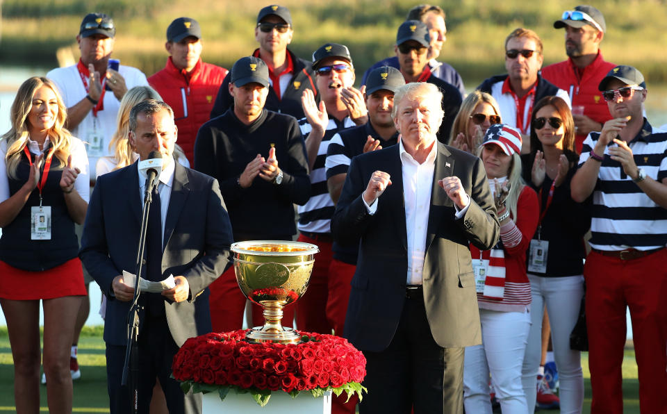 President Donald Trump presented the U.S. team with the trophy after they defeated the international team in the Presidents Cup at Liberty National Golf Club.&nbsp; (Photo: Rob Carr/Getty Images)