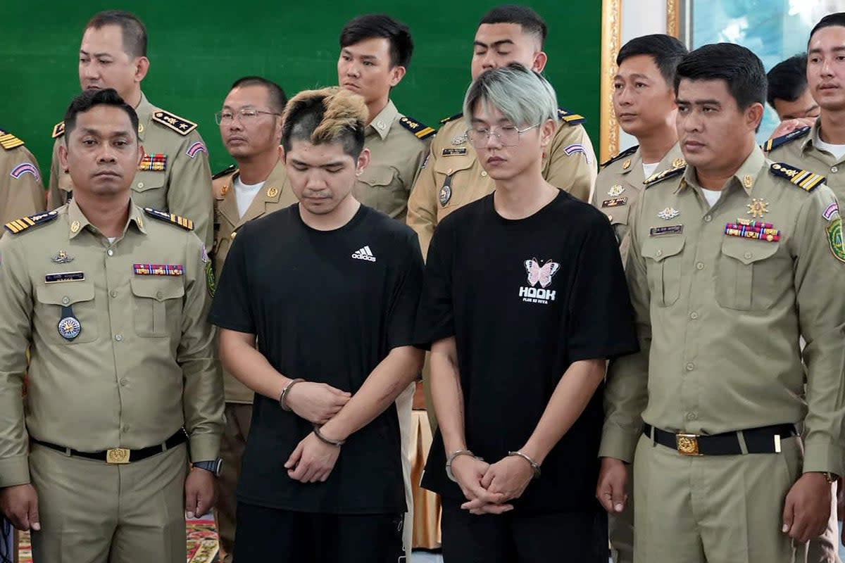 Taiwanese influencers after they were arrested for streaming video of a fake kidnapping (AFP PHOTO/Preah Sihanouk Provincial Administration)