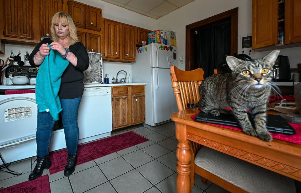 Corina Drury folds laundry at her South Mulberry St. home in Hagerstown.