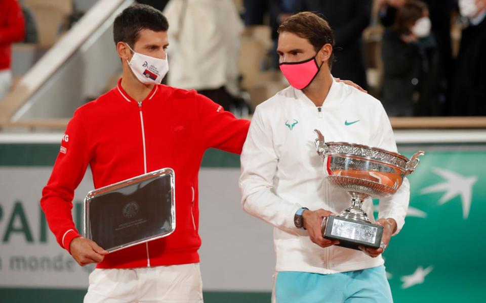 Rafael Nadal with his French Open trophy - REUTERS