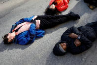 <p>Students from Fiorello H. Laguardia High School lie down on West 62nd street in support of the National School Walkout in the Manhattan borough of New York City, New York, U.S., March 14, 2018. (Photo: Mike Segar/Reuters) </p>