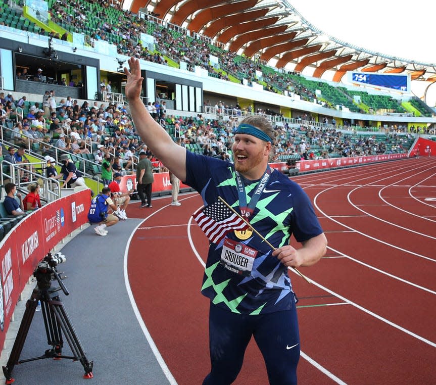 Ryan Crouser does a victory lap after winning the men's shot put on the first day of the 2021 U.S. Olympic Track & Field Trials at Hayward Field.