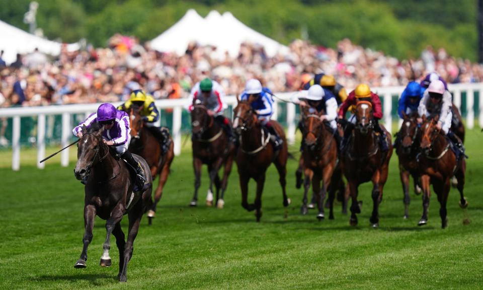 <span>Bedtime Story, ridden by Ryan Moore, surges clear of the chasing pack during a spine-tingling moment in Saturday’s Chesham Stakes.</span><span>Photograph: David Davies/PA</span>