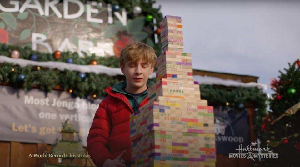 Screengrab from A World Record Christmas, which shows actor Aias Dalman playing a young autistic boy named Charlie, a role inspired by Auldin Maxwell who holds multiple Guinness Book of World Records for Jenga stacking.