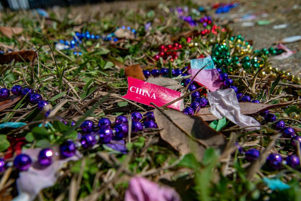 Beads litter the streets in Mobile.