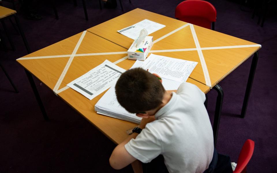 A child studies on a marked table at Kempsey Primary School in Worcester. - PA