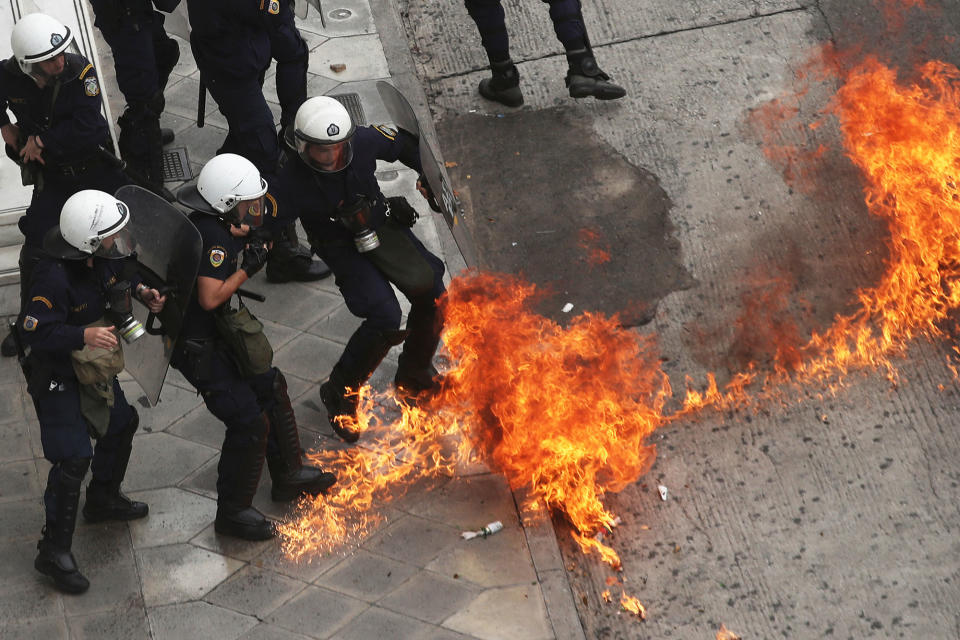 <p>Riot police officers try to avoid a patrol bomb thrown by protester during a nationwide general strike demonstration. in Athens Wednesday, May 17, 2017. Greek workers walked off the job across the country Wednesday for an anti-austerity general strike that was disrupting public and private sector services across the country. (AP Photo/Petros Giannakouris) </p>