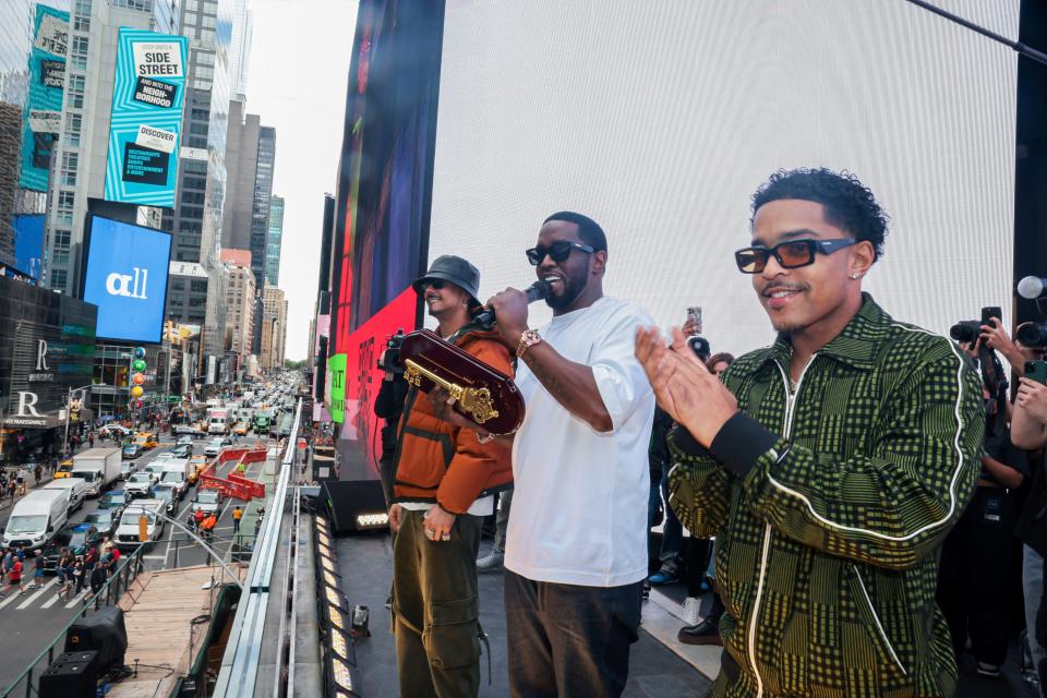 Sean "Diddy" Combs speaks holding the key to New York City Sept. 15 with sons Quincy Brown and Justin Combs.