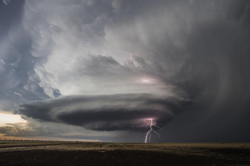 This May 21, 2020, photo provided by Victor Gensini shows a tornado in Moscow, Kan. A new study says warming will fuel more supercells or tornados in the United States and that those storms will move eastward from their current range. (Victor Gensini via AP)