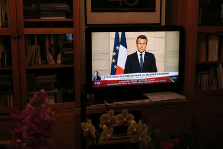 French President Emmanuel Macron, seen on all news channel LCI, speaks from the Elysee Palace in Paris, France, after U.S. President Donald Trump announced his decision that the United States will withdraw from the Paris Climate Agreement at a news conference, June 1, 2017. REUTERS/John Schults