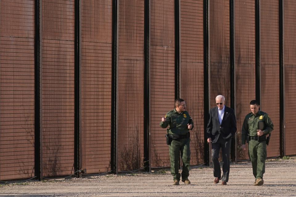 President Joe Biden walks with U.S. Border Patrol agents along a stretch of the U.S.-Mexico border in El Paso on Jan. 8, 2023. The president and former President Donald Trump will both be visiting the Texas border Thursday.