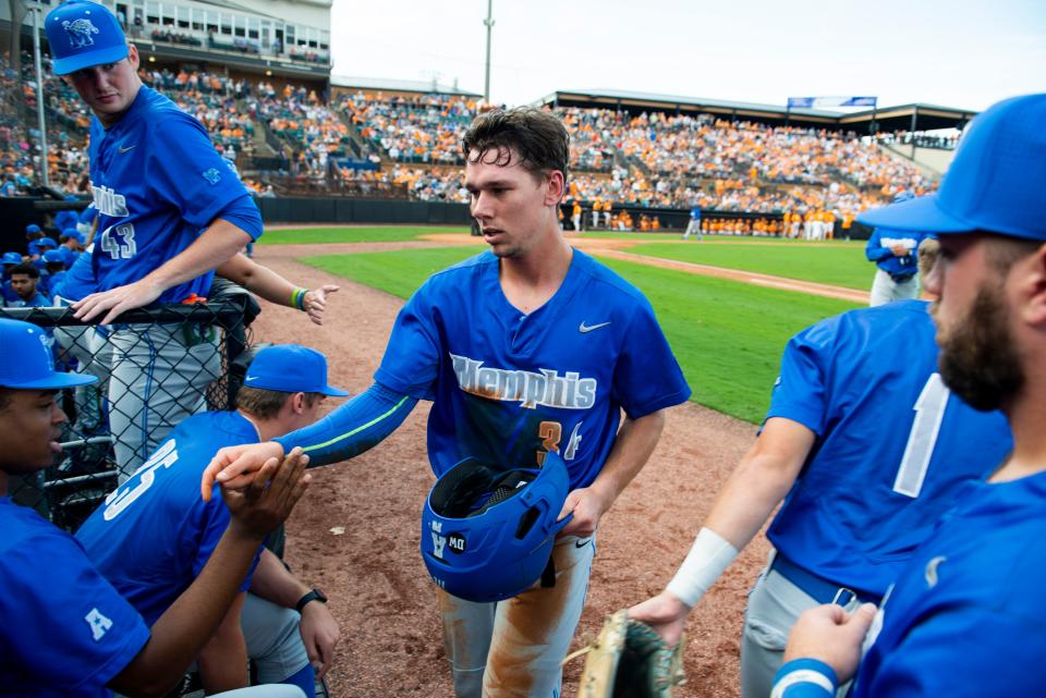 Memphis’ Brennan DeBose (34) is cheered on by his teammates as he returns to the dugout during the game against Tennessee on Sunday, November 6, 2022, at The Ballpark at Jackson in Jackson, Tenn. The teams played an 18-inning game as the last official game of the fall season. Tennessee outscored Memphis 22-4. 