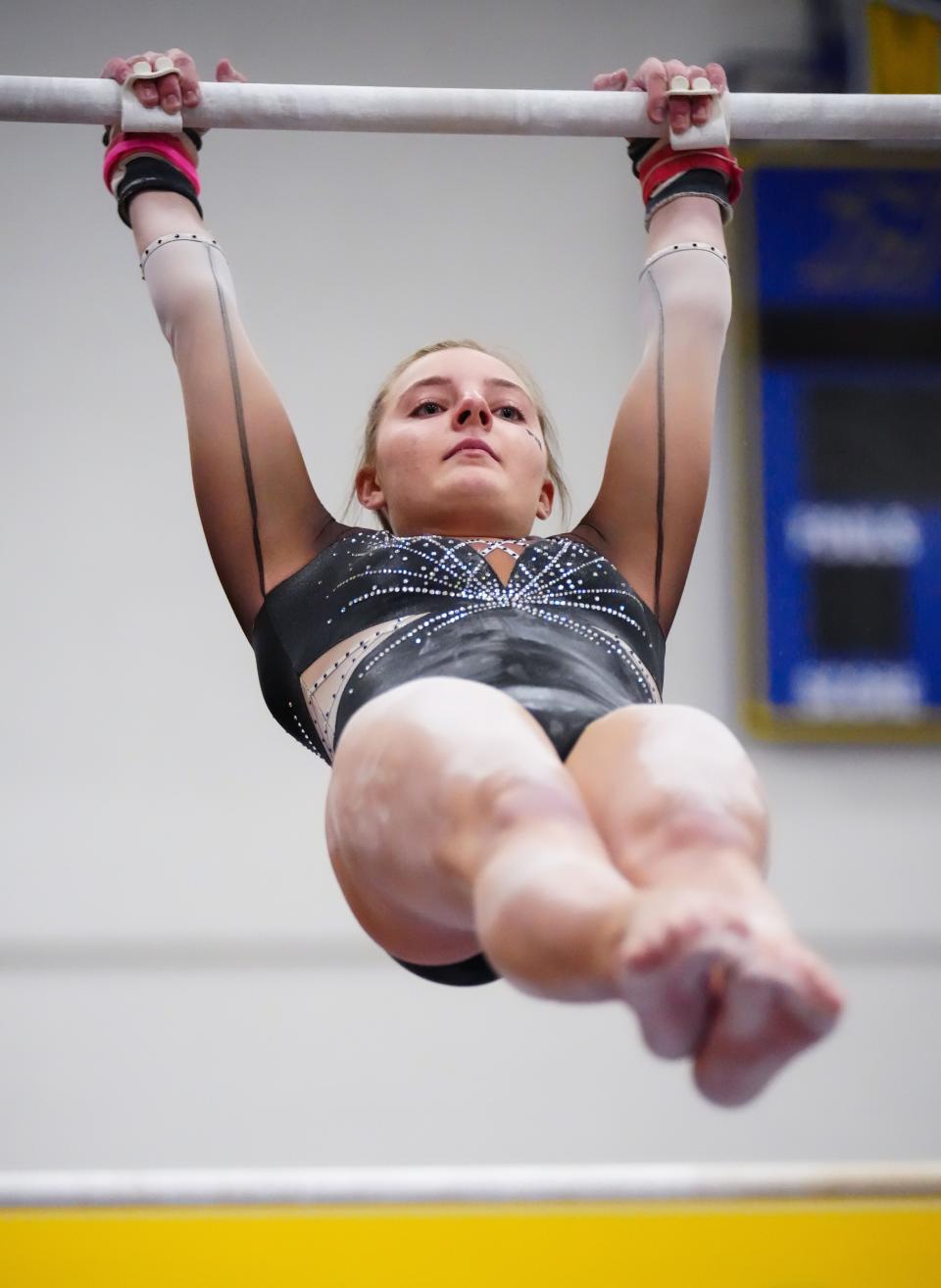 Franklin/Muskego co-op gymnast Kaylee Stoeger competes on the uneven bars during the Division 1 sectional at Mukwonago High School in February.