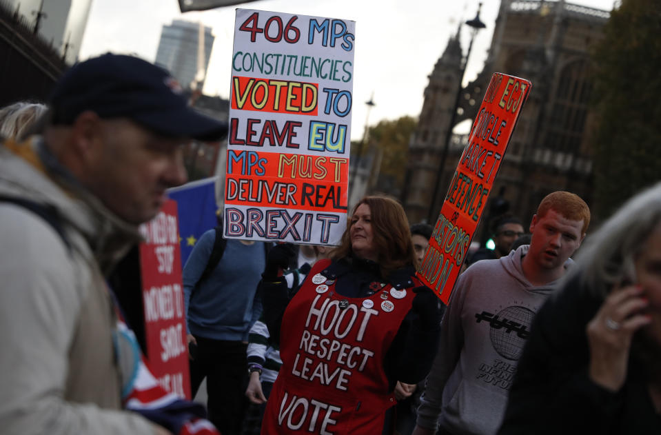 Pro-Brexit supporters demonstrate outside the Houses of Parliament on the final day of the lawmakers sitting before the start of the general election campaign in London, Tuesday, Nov. 5, 2019. Britain goes to the polls on Dec. 12. (AP Photo/Alastair Grant)
