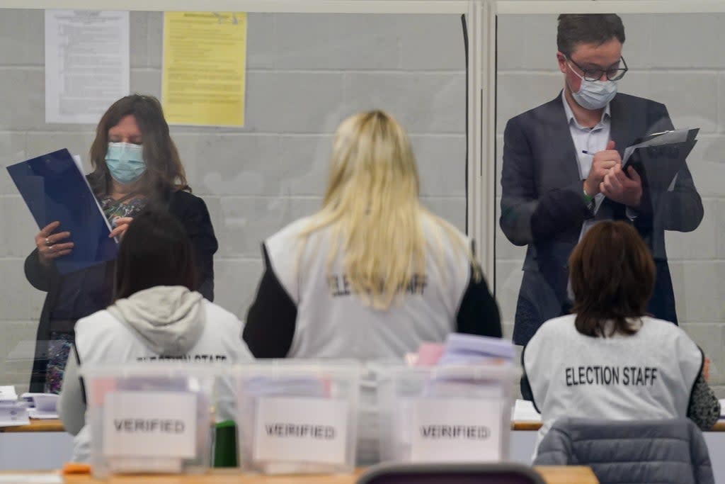 Observers watch election staff sorting votes during the count for the North Shropshire by-election at Shrewsbury Sports Village (Jacob King/PA) (PA Wire)