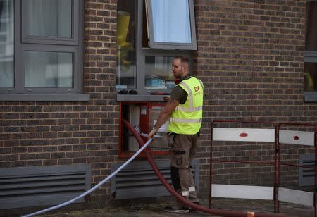 Safety equipment is checked at the Dorney Tower residential block, after residents were evacuated as a precautionary measure following concerns over the type of cladding used on the outside of the buildings on the Chalcots Estate in north London, Britain, June 26, 2017. REUTERS/Hannah McKay