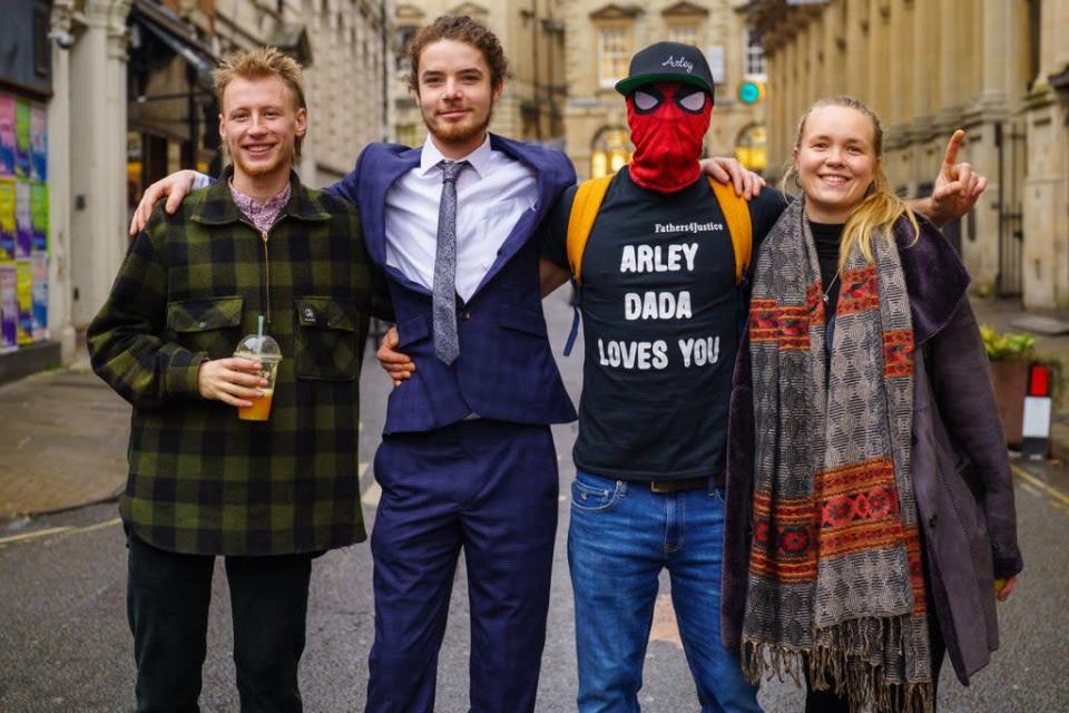 Milo Ponsford, left, Sage Willoughby, second left, Jake Skuse, second right in mask, and Rhian Graham outside Bristol Crown Court (Ben Birchall/PA) (PA Wire)