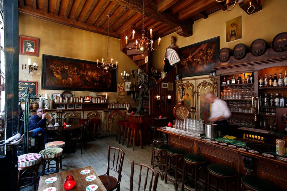 One of the oldest “brown bars” in Amsterdam, tobacco-stained In 't Aepjen has been serving beer and local spirit jenever since the early 1600s. <span class="copyright">Photograph by Miguel Gonzalez, Nat Geo Image Collection</span>