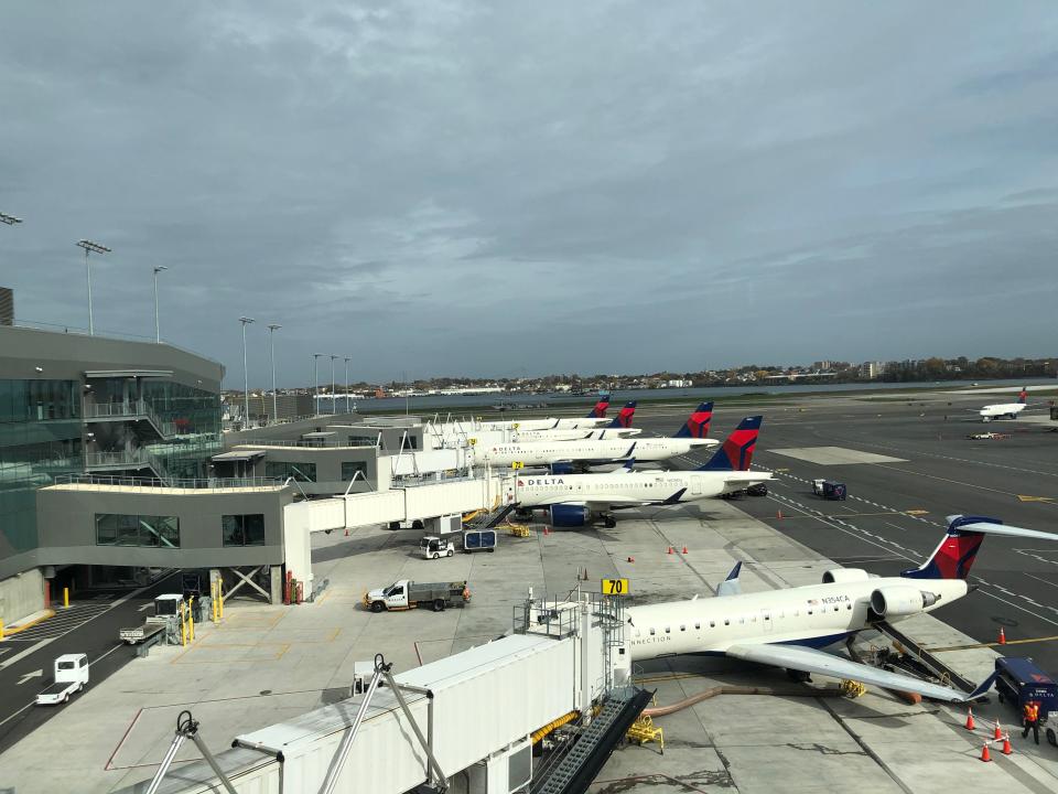 A row of Delta Air Lines planes, with a regional jet in the foreground similar to the one I was scheduled to fly on to Myrtle Beach.