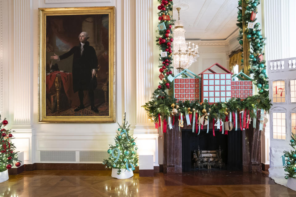 Holiday decorations adorn the East Room of the White House for the 2023 theme "Magic, Wonder, and Joy," Monday, Nov. 27, 2023, in Washington. (AP Photo/Evan Vucci)