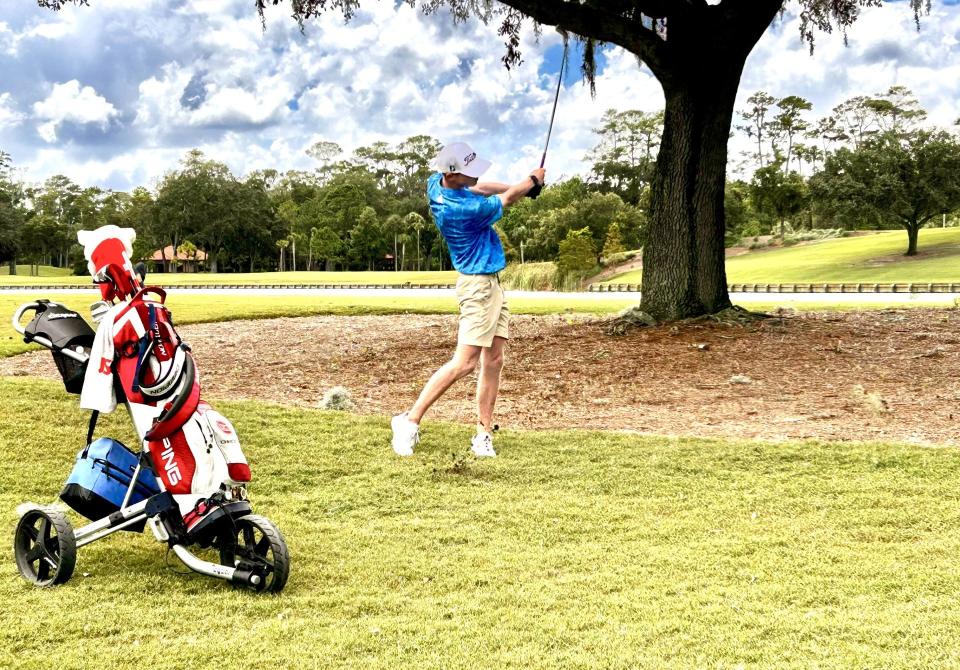 Hamilton Coleman of Augusta, Ga., punches his second shot out of the rough on the right side of the 18th fairway of the Players Stadium Course at TPC Sawgrass during the second round of the Junior Players Championship on Aug. 31. Coleman shot 68 and is in second place.