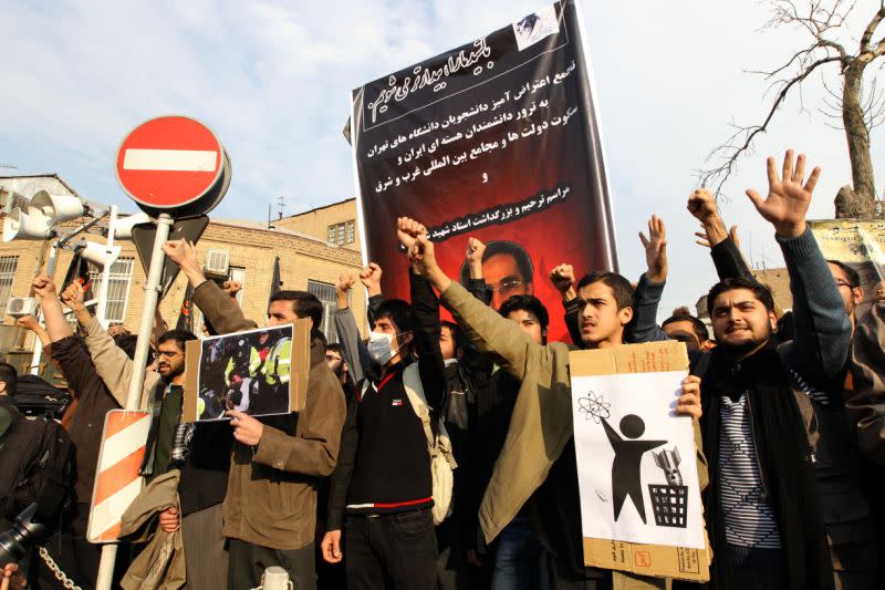 Dozens of basijis, members of Iran's hardline Islamist militia, demonstrate in front of Britain's embassy in downtown Tehran on Dec. 12, 2010 over the killing of a top Iranian nuclear scientist last month. Iranian leaders have pointed an accusing finger at the British intelligence service the MI6 as well as US and Israeli intelligence over the assassination. (Photo: Atta Kenare/AFP/Getty Images)