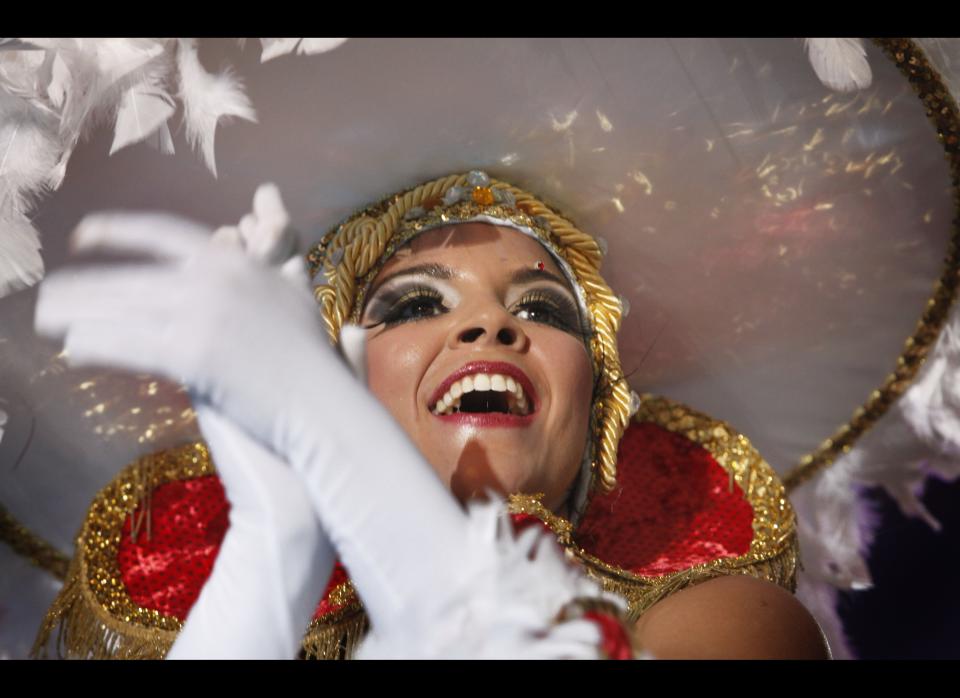 A dancer participates in the contest of 'Comparsas' (dance groups) of the carnival of Santa Cruz de Tenerife, in the Spanish Canary island of Tenerife on February 11, 2012. (DESIREE MARTIN/AFP/Getty Images)