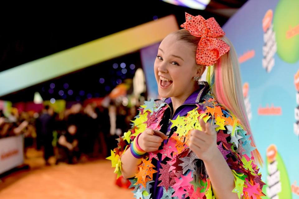Until recently JoJo Siwa’s signature style was all about color — as seen here in 2019 during Nickelodeon’s Kid’s Choice Awards. Getty Images