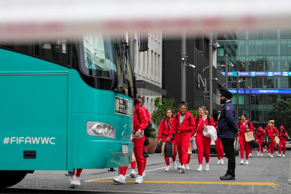 Members of the Philippines Women's World Cup team walk to their team bus (AP)