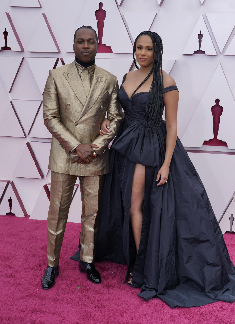 Leslie Odom Jr., left, and Nicolette Robinson arrive at the Oscars on Sunday, April 25, 2021, at Union Station in Los Angeles. (AP Photo/Chris Pizzello, Pool)