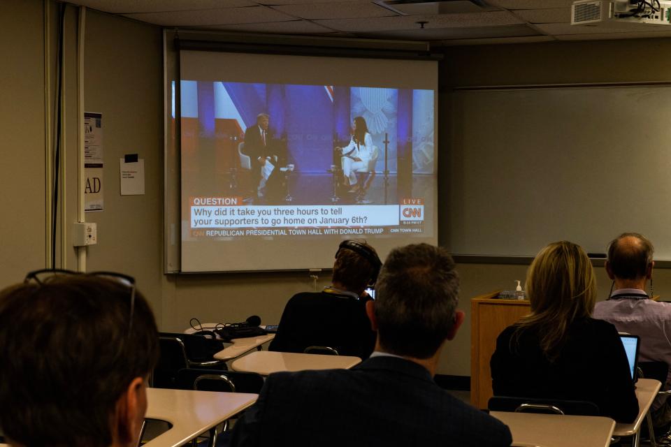 Reporters watch a CNN town hall with former US President and 2024 Presidential hopeful Donald Trump at St. Anselm College in Manchester, New Hampshire, on May 10, 2023. (Photo by Joseph Prezioso / AFP) (Photo by JOSEPH PREZIOSO/AFP via Getty Images)