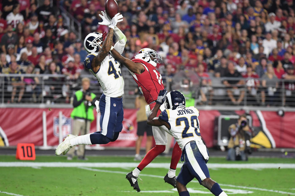 <p>Strong safety John Johnson #43 and free safety Lamarcus Joyner #20 of the Los Angeles Rams break up a pass intended for wide receiver J.J. Nelson #14 of the Arizona Cardinals during the second half of the NFL game at the University of Phoenix Stadium on December 3, 2017 in Glendale, Arizona. (Photo by Norm Hall/Getty Images) </p>