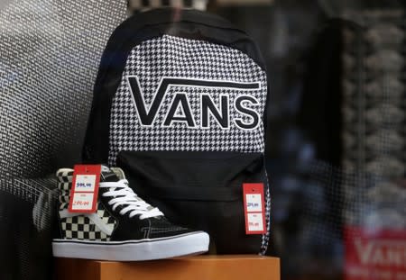 Shoes and backpack of Vans are seen in a shop window in Sao Paulo