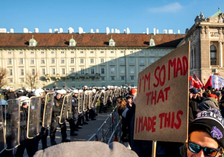 A heavy police presence of about 1,500 officers, with helicopters overhead and water-cannon trucks at the ready, blocked off the area around the Hofburg palace