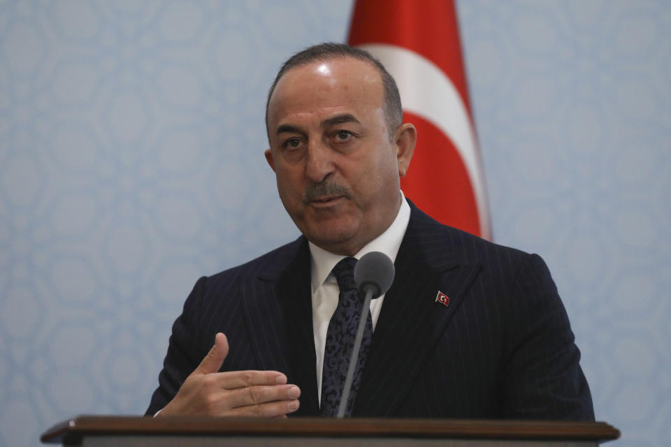 Turkish Foreign Minister Mevlut Cavusoglu answers a question during a joint news conference with U.S. Secretary of State Antony Blinken following their meeting in Ankara, Turkey, Monday, Feb. 20, 2023. (AP Photo/Burhan Ozbilici)