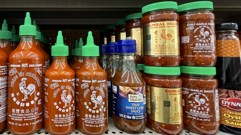 Different bottles and jars of hot sauces