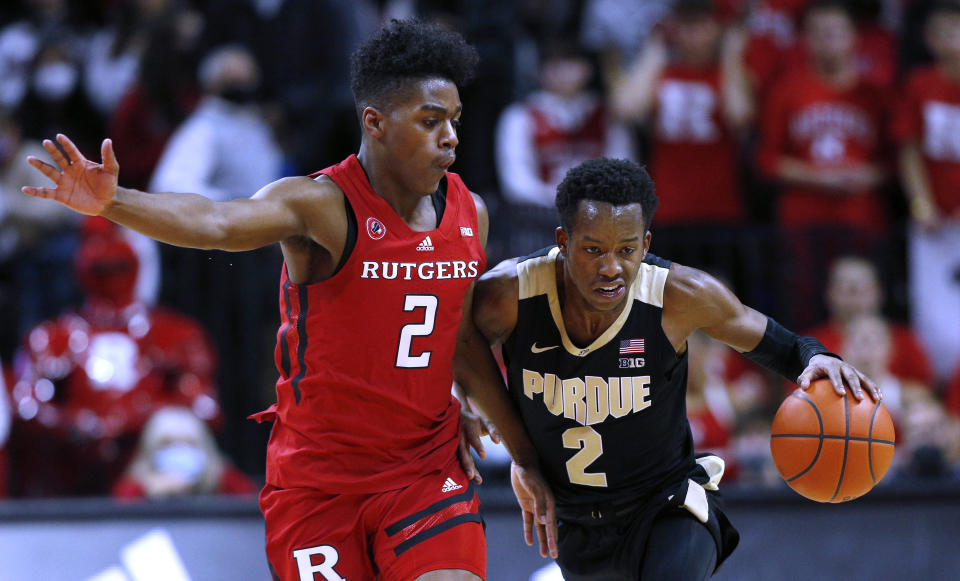 Purdue guard Eric Hunter Jr. (2) drives to the basket against Rutgers guard Jalen Miller (2) during the first half of an NCAA college basketball game in Piscataway, N.J., Thursday, Dec. 9, 2021. (AP Photo/Noah K. Murray)