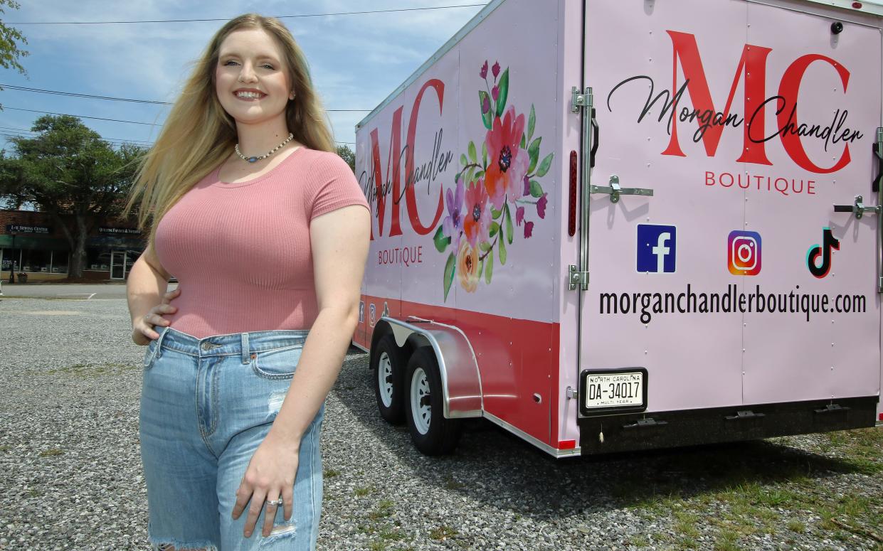 Morgan Laughlin stands next to her mobile Morgan Chandler Boutique Friday afternoon, July 22, 2022, on West Graham Street in Shelby. It is the first mobile boutique in Shelby and will launch in August at the 7th Inning Stretch Festival.