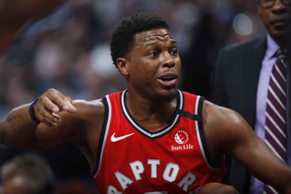 Toronto Raptors guard Kyle Lowry talks to teammates during a timeout in the first half of an NBA basketball game against the Denver Nuggets, Sunday, March 1, 2020. (AP Photo/David Zalubowski)