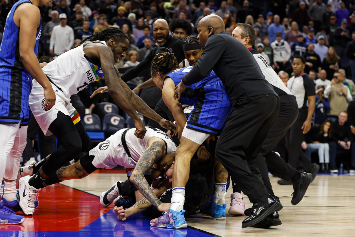 MINNEAPOLIS, MN - FEBRUARY 03: Members of the Orlando Magic and Minnesota Timberwolves get into a scrum in the third quarter of the game at Target Center on February 03, 2023 in Minneapolis, Minnesota. Mo Bamba #11, Jalen Suggs #4 of the Orlando Magic and Austin Rivers #25 of the Minnesota Timberwolves were ejected from the game. NOTE TO USER: User expressly acknowledges and agrees that, by downloading and or using this Photograph, user is consenting to the terms and conditions of the Getty Images License Agreement. (Photo by David Berding/Getty Images)