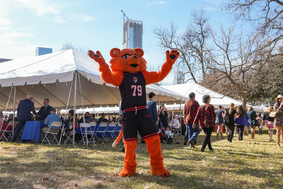 Sammy Bearkat, mascot of Sam Houston State University, dances to live music during A Taste of Texas on the south Capitol of Texas lawn Tuesday, Jan. 17, 2023. The event showcased 10 restaurants that represent the food of their Texas cities as a celebration following the inauguration of Governor Greg Abbott and Lieutenant Governor Dan Patrick.<br>Taste Of Texas Mlc 00259