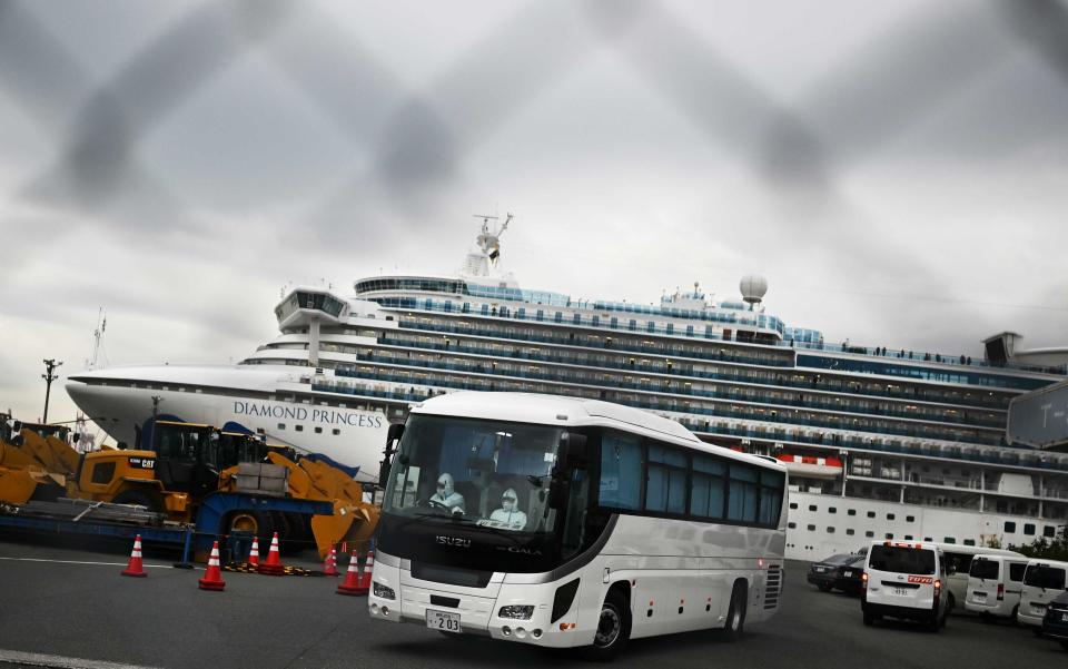 Older passengers who tested negative for coronavirus are moved off the quarantined Diamond Princess and into government-designated lodging - Getty